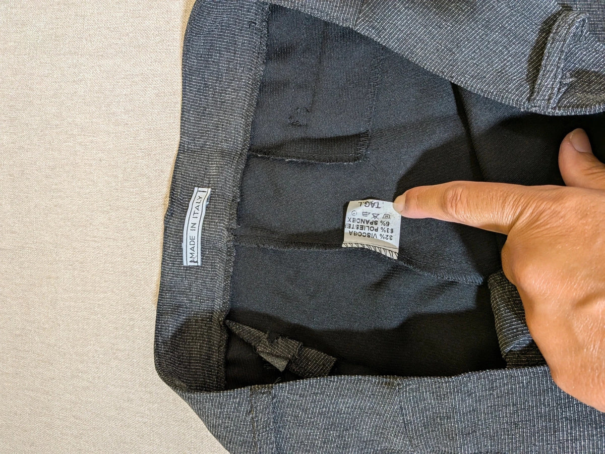 Made in Italy grey suit with three-button jacket and straight-leg trousers, soft fabric.