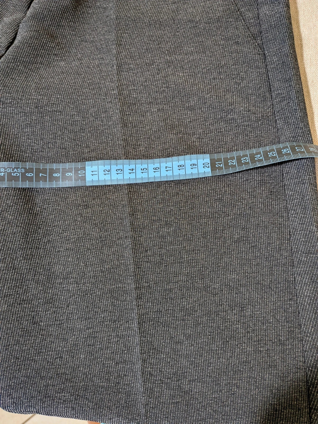 Made in Italy grey suit with three-button jacket and straight-leg trousers, soft fabric.
