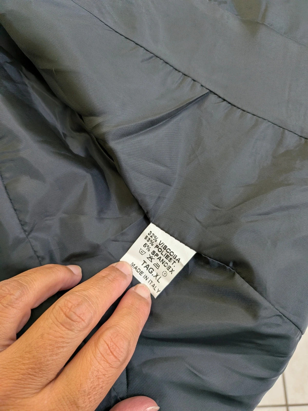 Made in Italy grey suit with three-button jacket and straight-leg trousers, soft fabric.