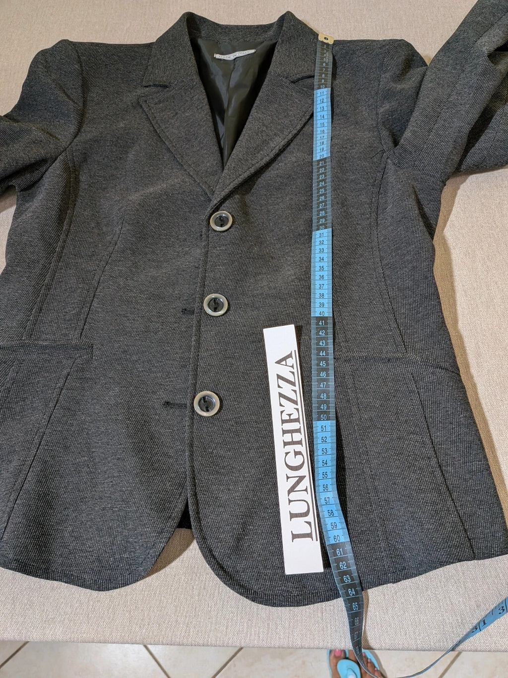 Made in Italy grey suit with three-button jacket and straight-leg trousers, soft fabric.