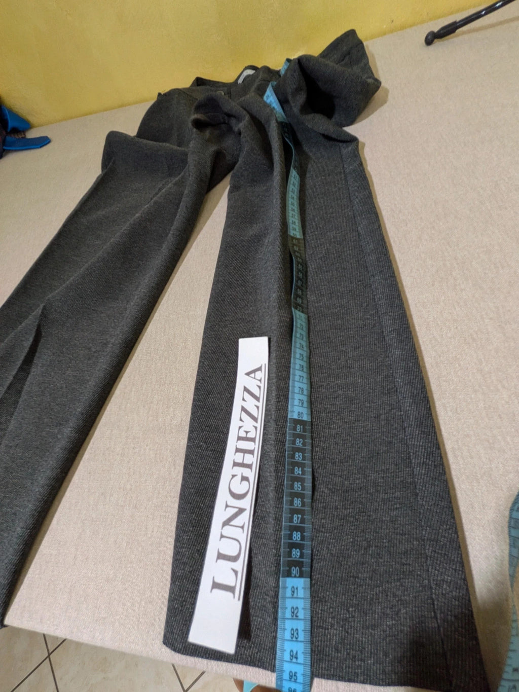 Made in Italy grey suit with three-button jacket and straight-leg trousers, soft fabric.