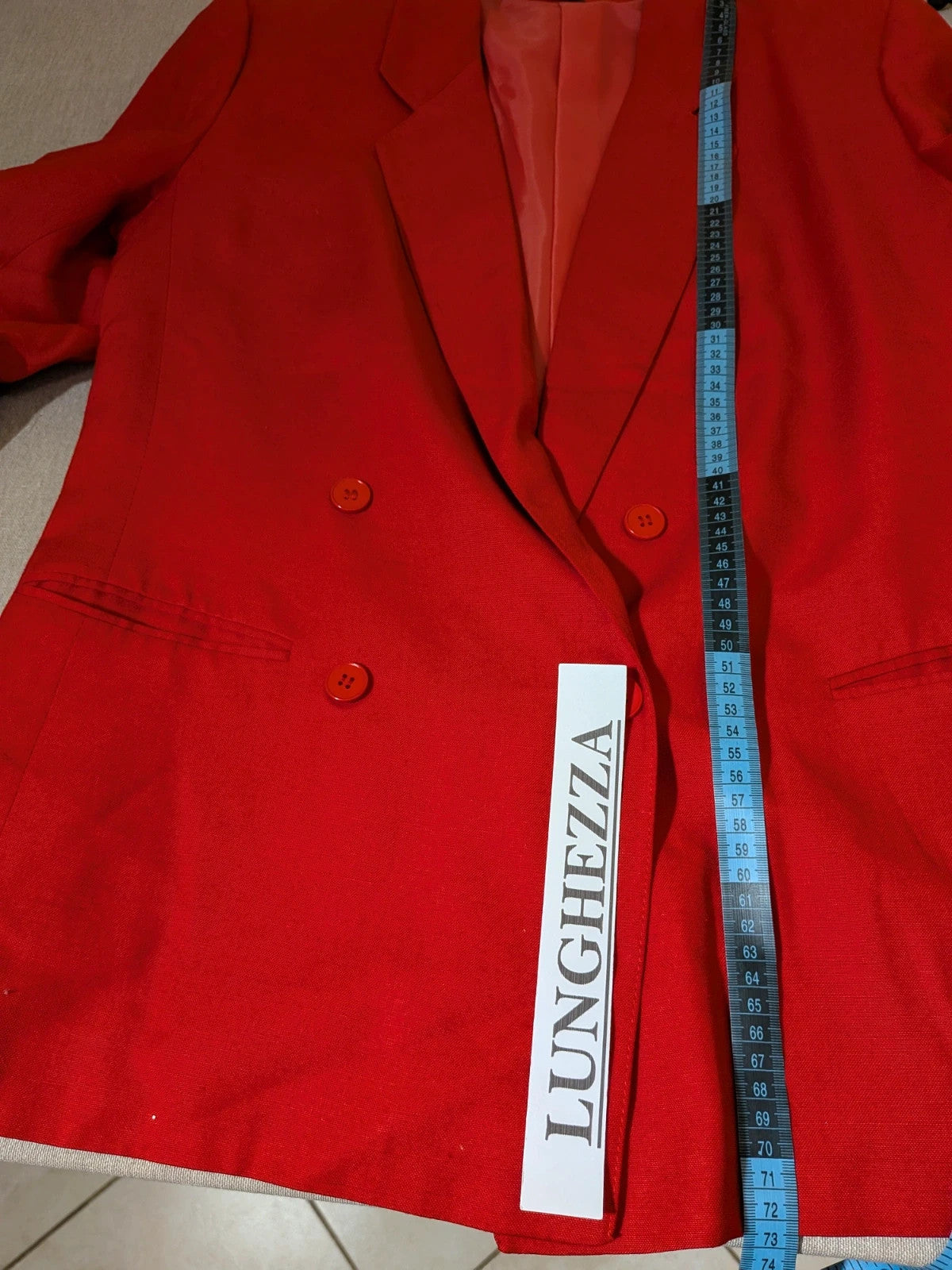 Tessuto red skirt suit with double-breasted jacket and linen-like texture.