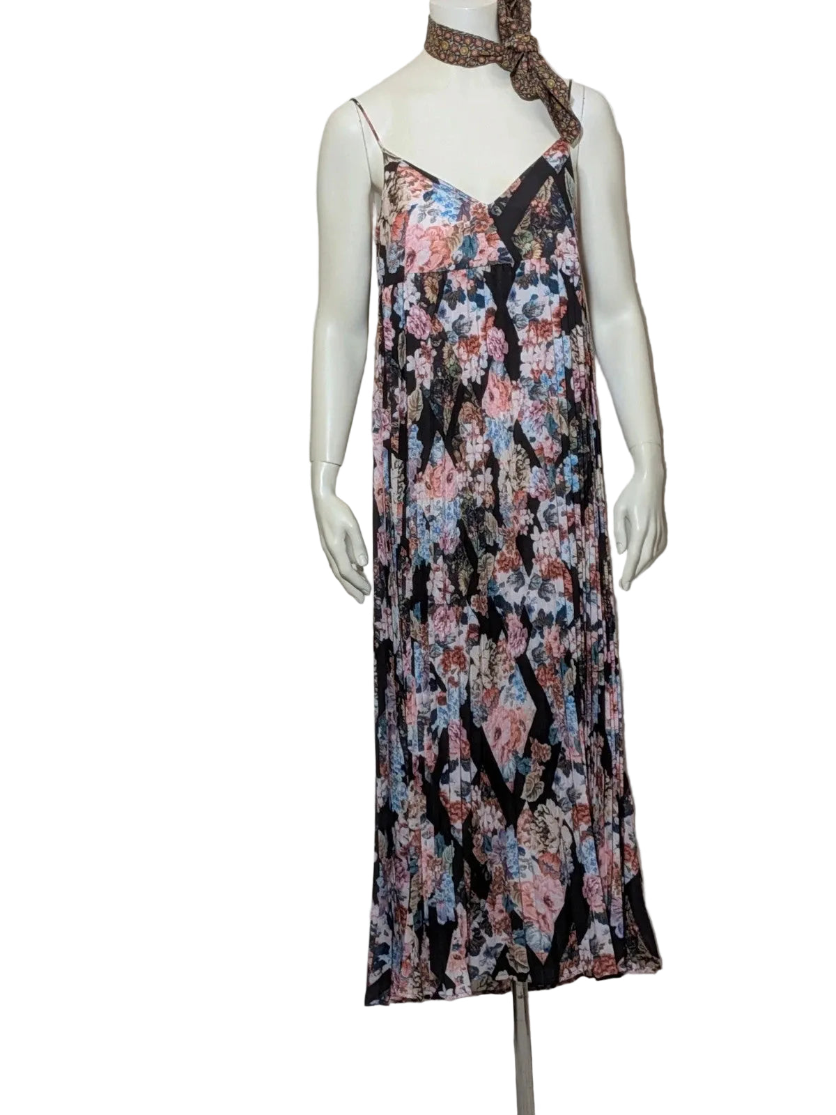 Maryan Mehlhorn multi linen maxi dress with pleated design and floral print on black background.