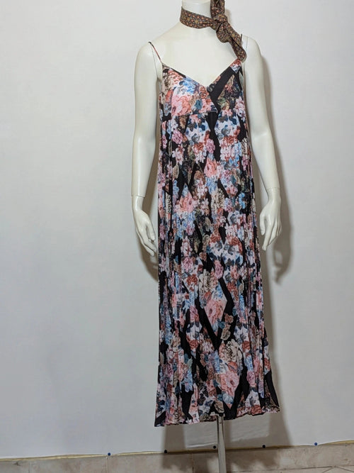 Maryan Mehlhorn multi linen maxi dress with pleated design and floral print on black background.