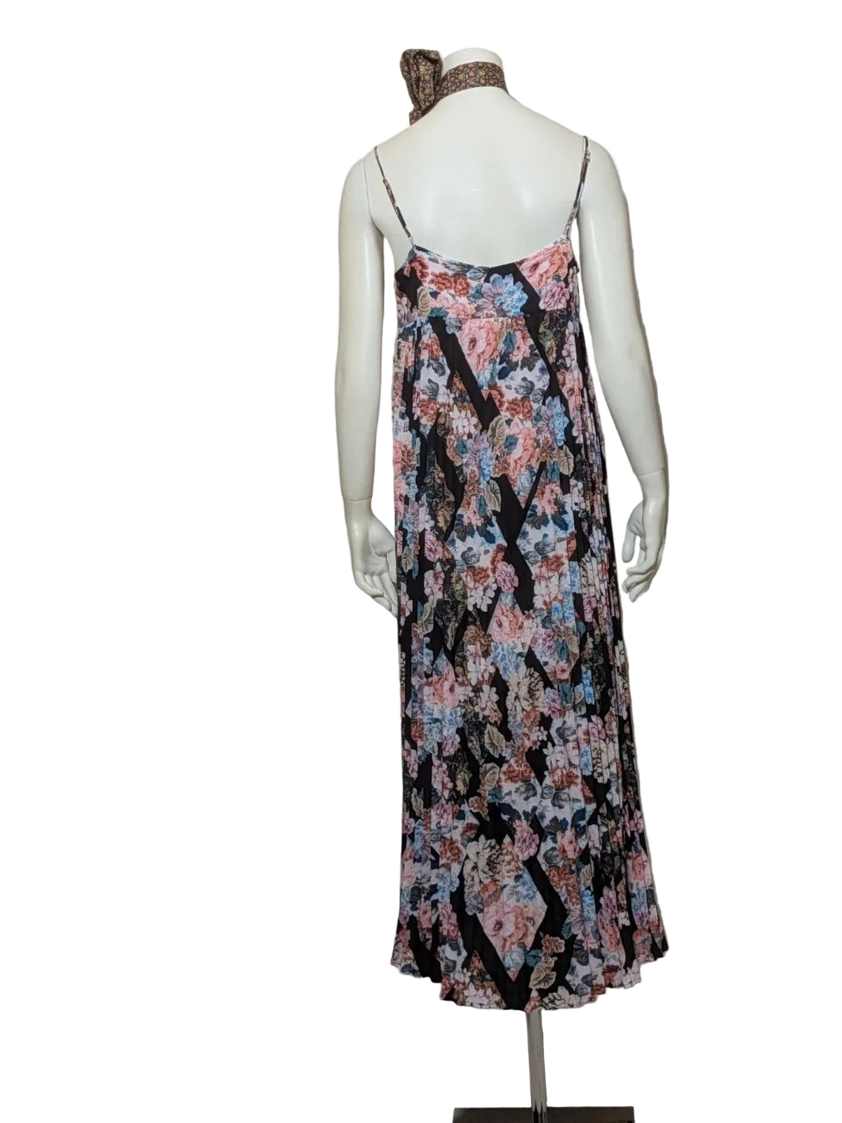 Maryan Mehlhorn multi linen maxi dress with pleated design and floral print on black background.