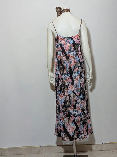 Maryan Mehlhorn multi linen maxi dress with pleated design and floral print on black background.