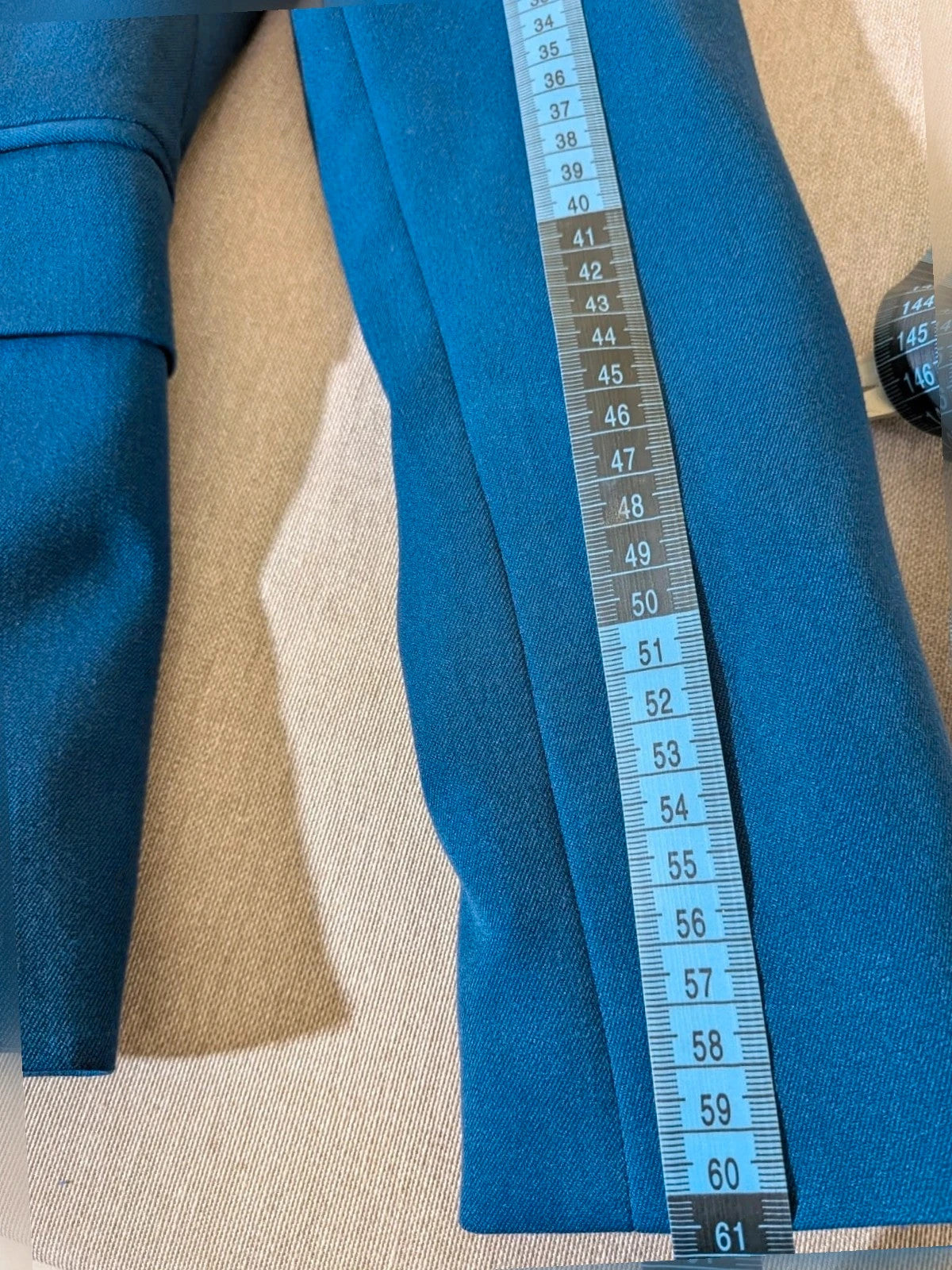 ONLY navy blazer with single-button closure and faux front pockets, modern fitted cut.