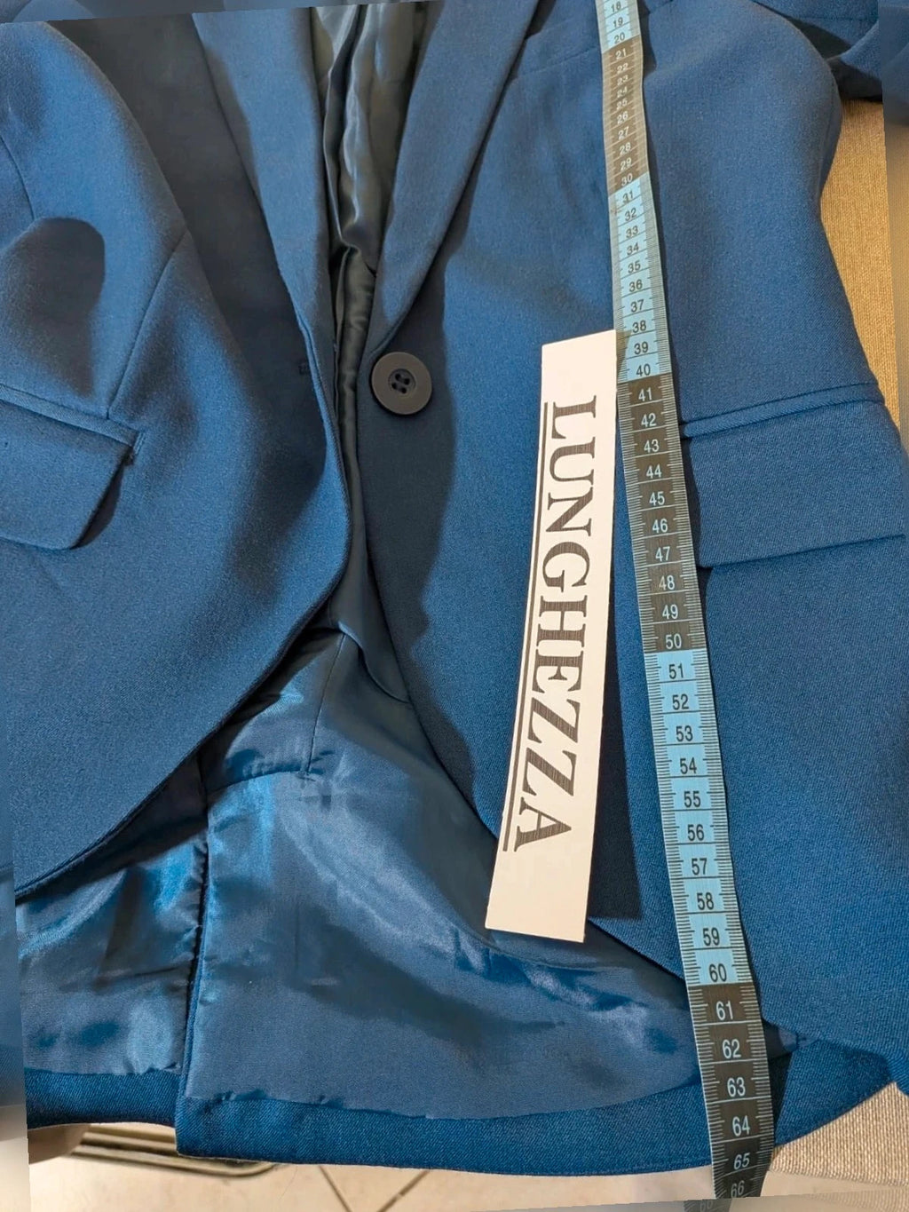 ONLY navy blazer with single-button closure and faux front pockets, modern fitted cut.
