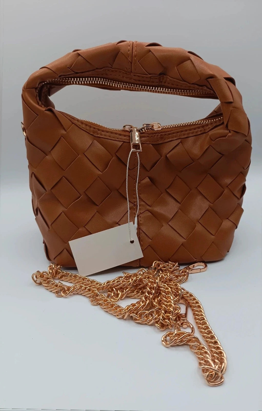 Pelle brown handbag with gold crossbody strap and textured PU leather.