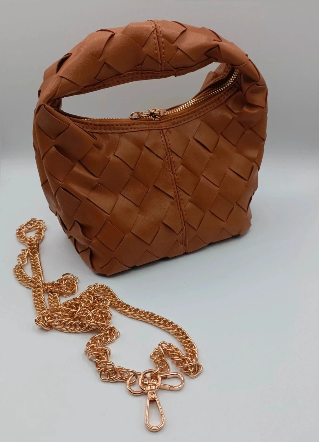 Pelle brown handbag with gold crossbody strap and textured PU leather.