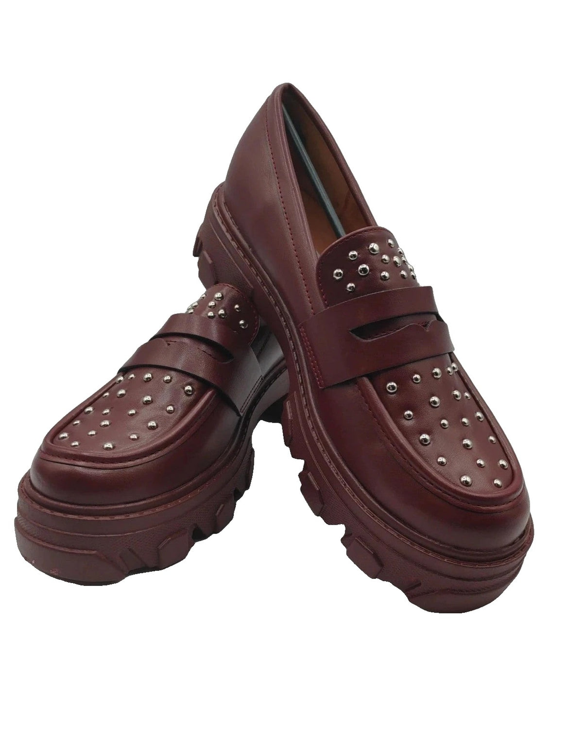 Mocassino burgundy shoes with high sole and sleek design.