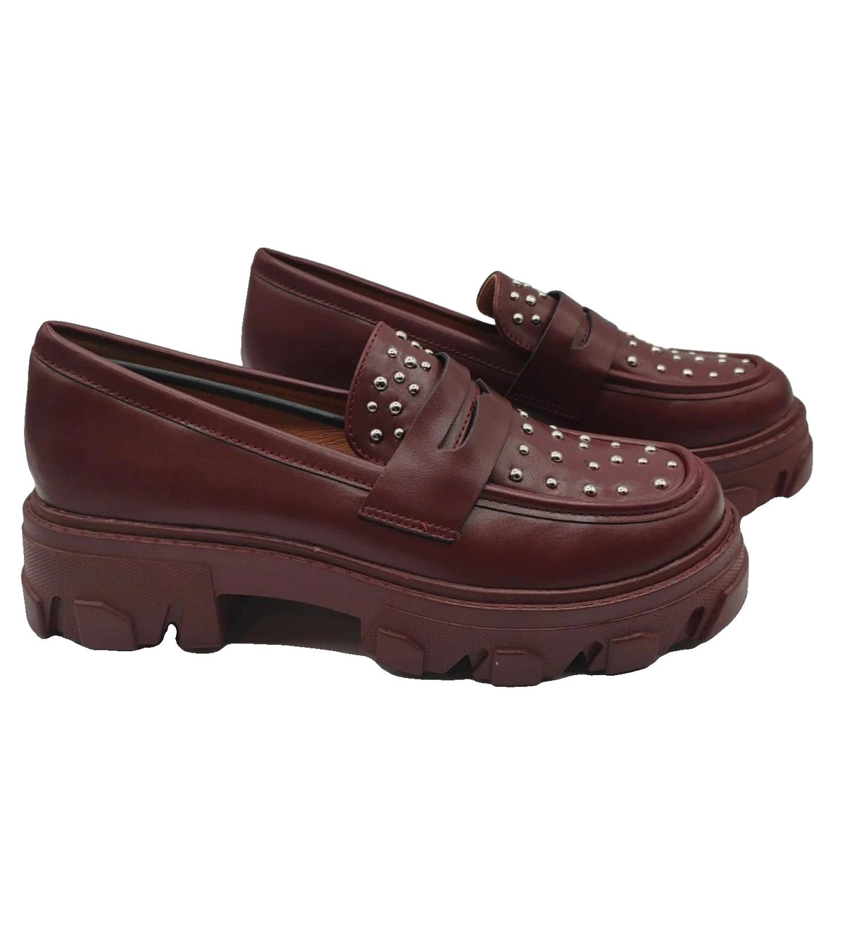 Mocassino burgundy shoes with high sole and sleek design.