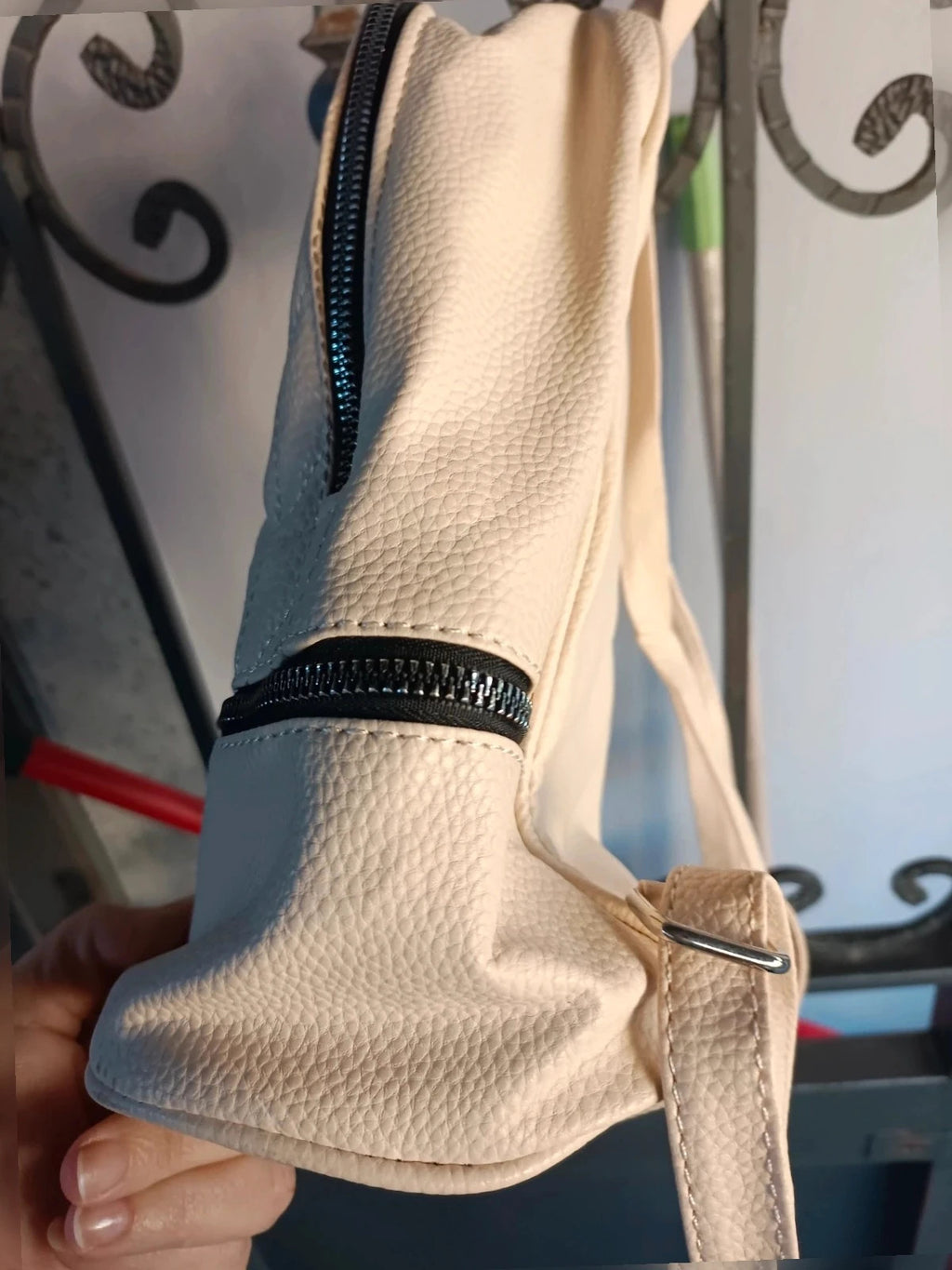 Zainetto cream backpack with minimalist design and subtle logo detail.