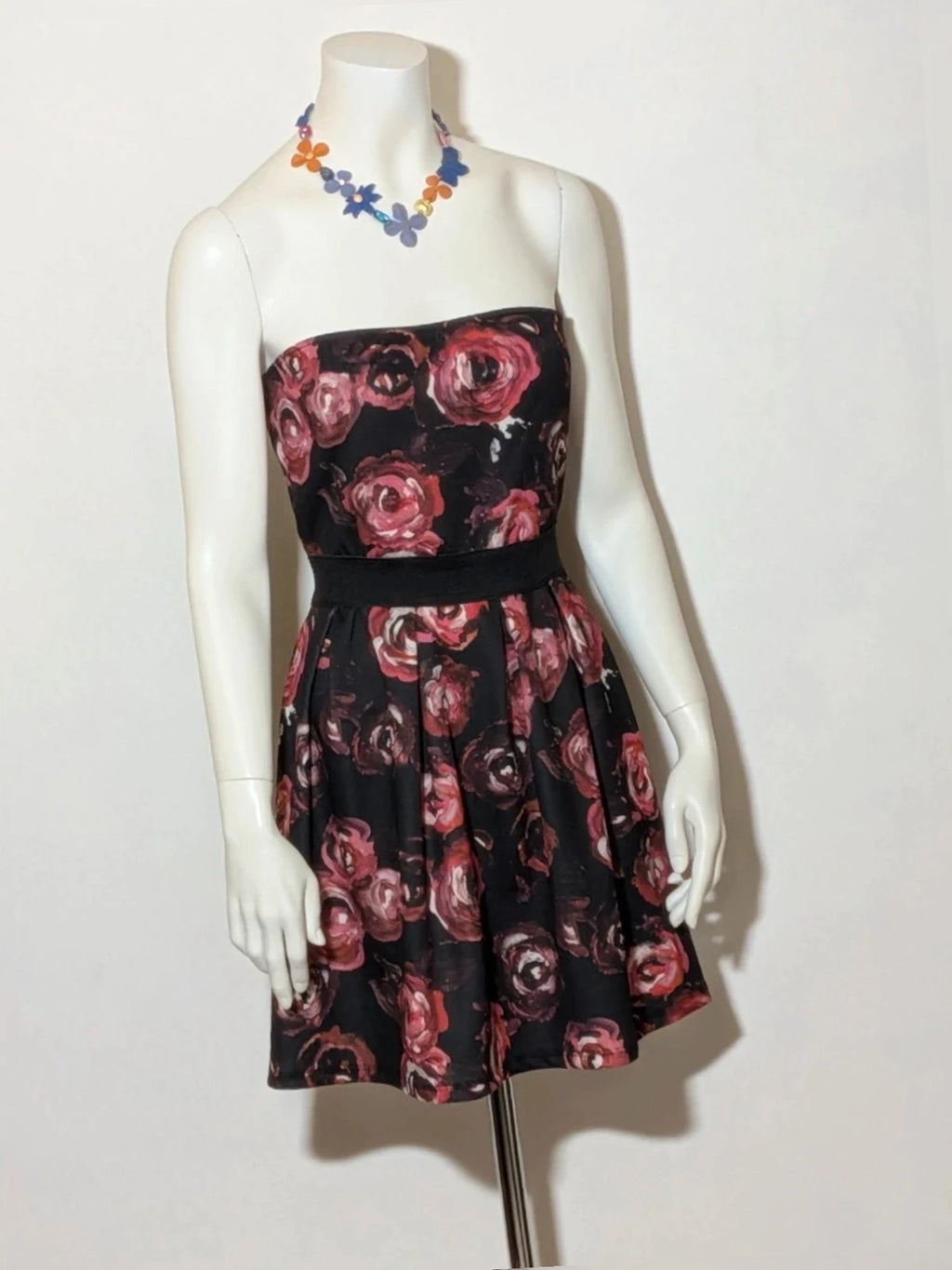 Artigli black linen maxi dress with floral pattern in pink and burgundy, strapless design.