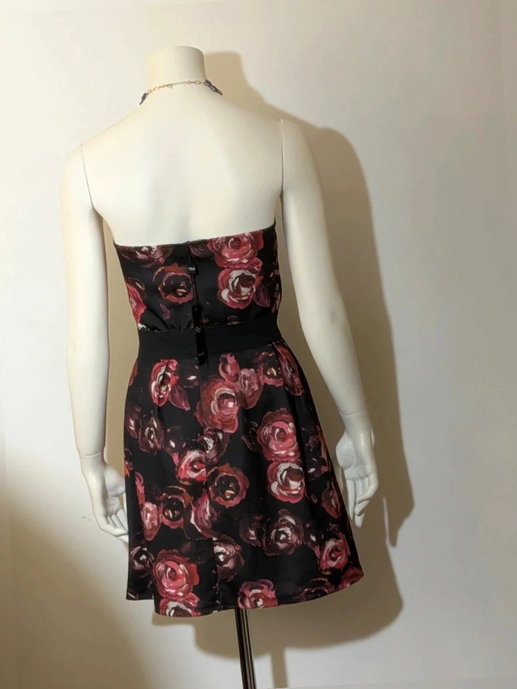 Artigli black linen maxi dress with floral pattern in pink and burgundy, strapless design.