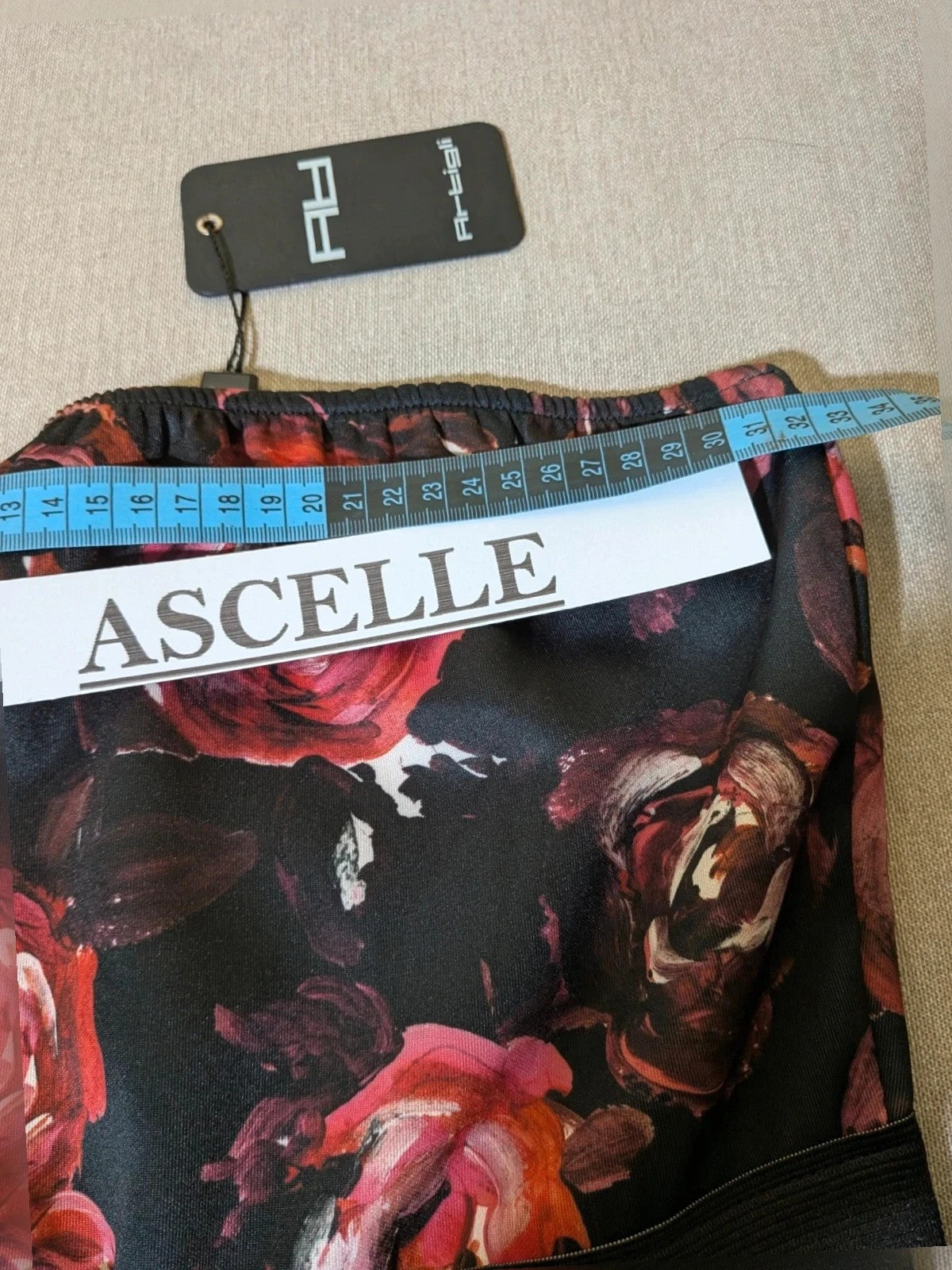 Artigli black linen maxi dress with floral pattern in pink and burgundy, strapless design.