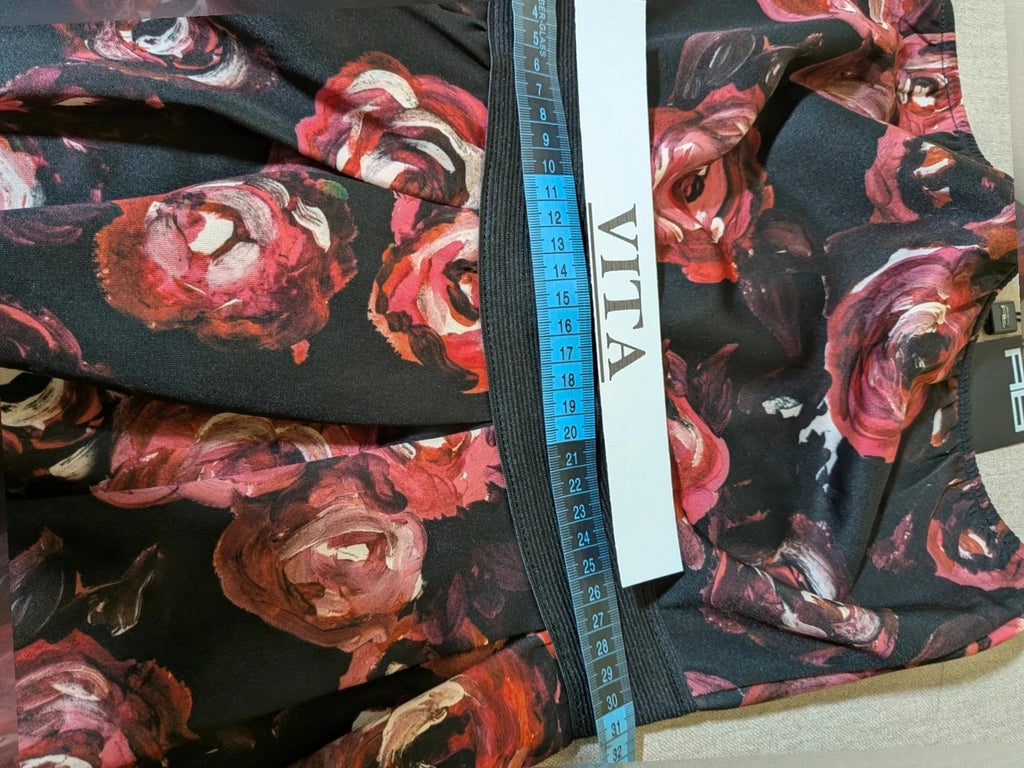 Artigli black linen maxi dress with floral pattern in pink and burgundy, strapless design.