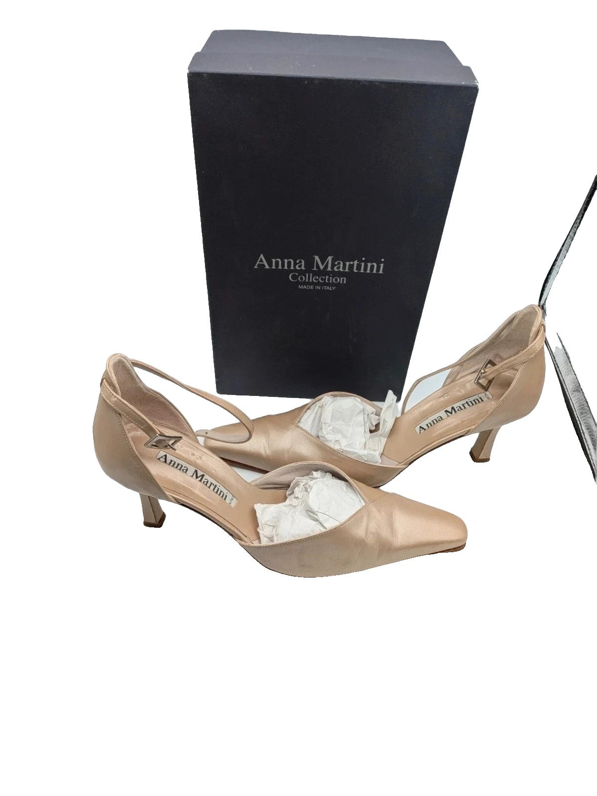 Anna Martini beige heels with satin finish, pointed toe, and adjustable ankle strap.