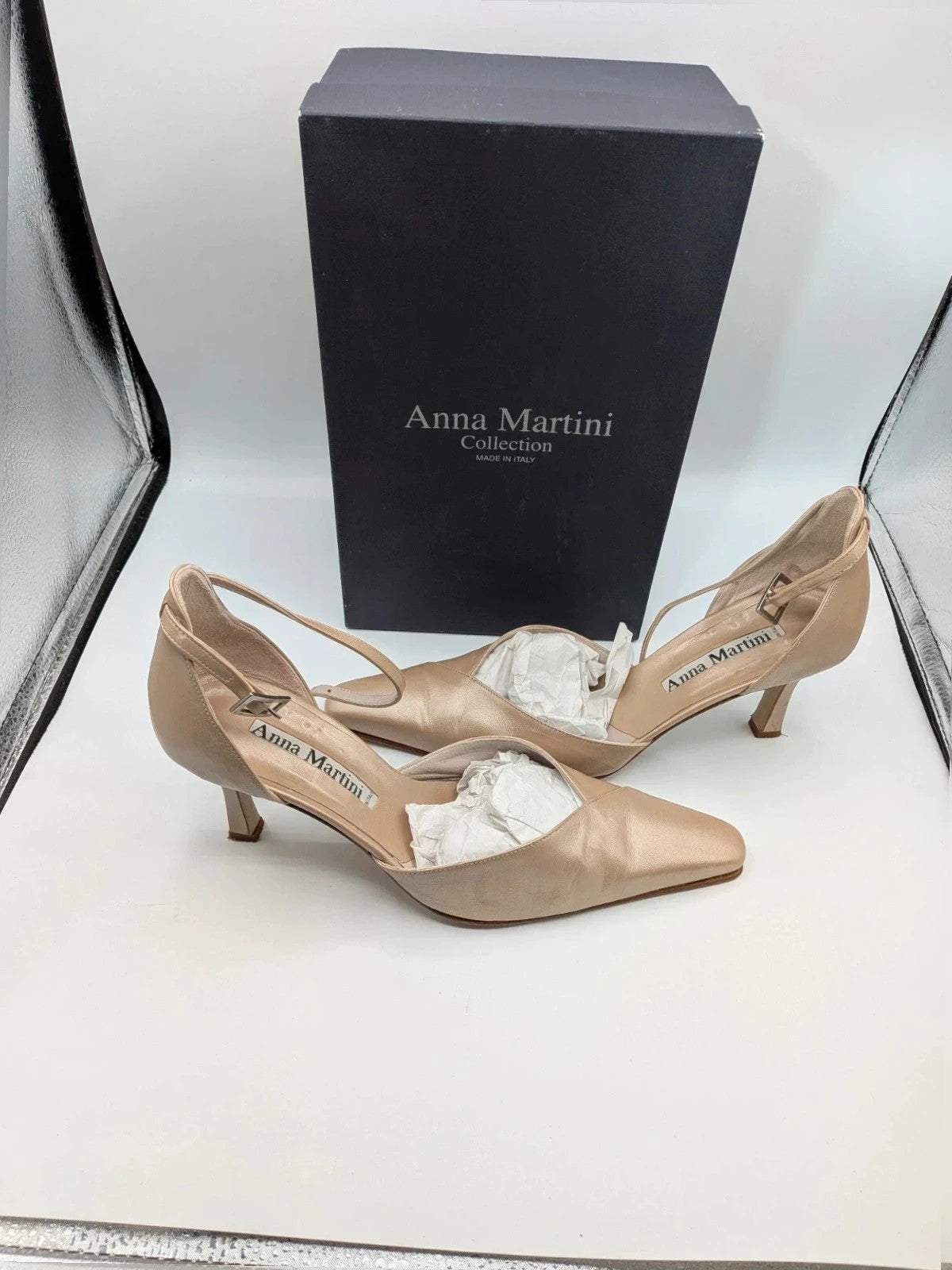 Anna Martini beige heels with satin finish, pointed toe, and adjustable ankle strap.