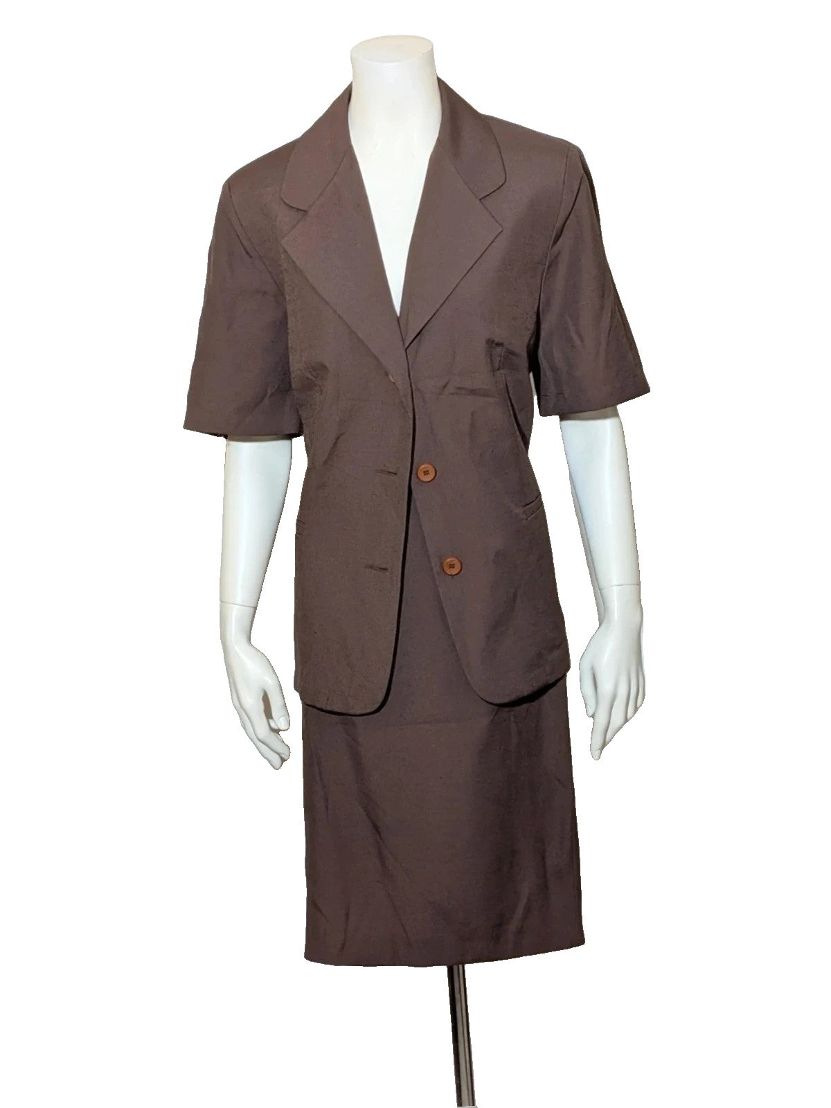 Blazer brown skirt suit with short sleeves, natural fabric texture, vintage style.