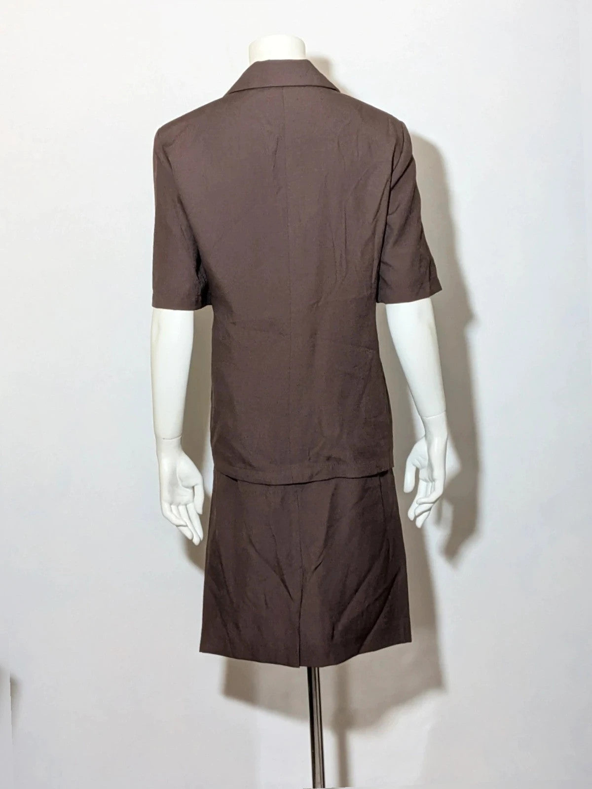 Blazer brown skirt suit with short sleeves, natural fabric texture, vintage style.