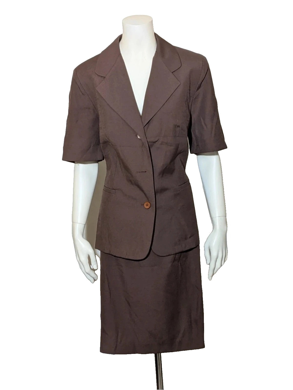 Blazer brown skirt suit with short sleeves, natural fabric texture, vintage style.