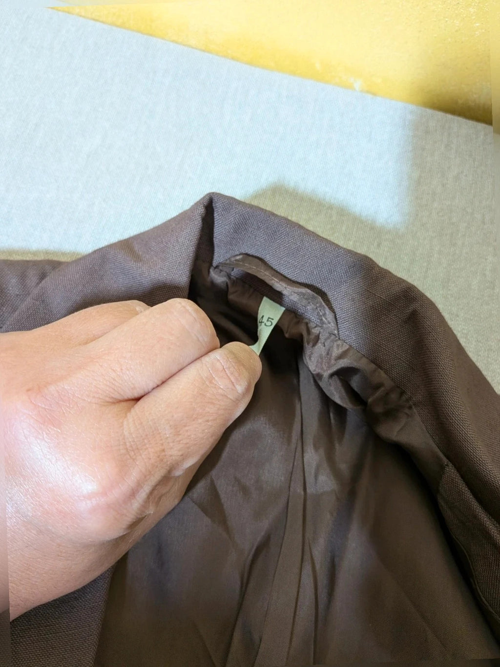 Blazer brown skirt suit with short sleeves, natural fabric texture, vintage style.