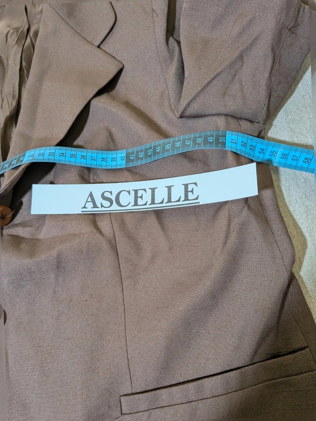 Blazer brown skirt suit with short sleeves, natural fabric texture, vintage style.
