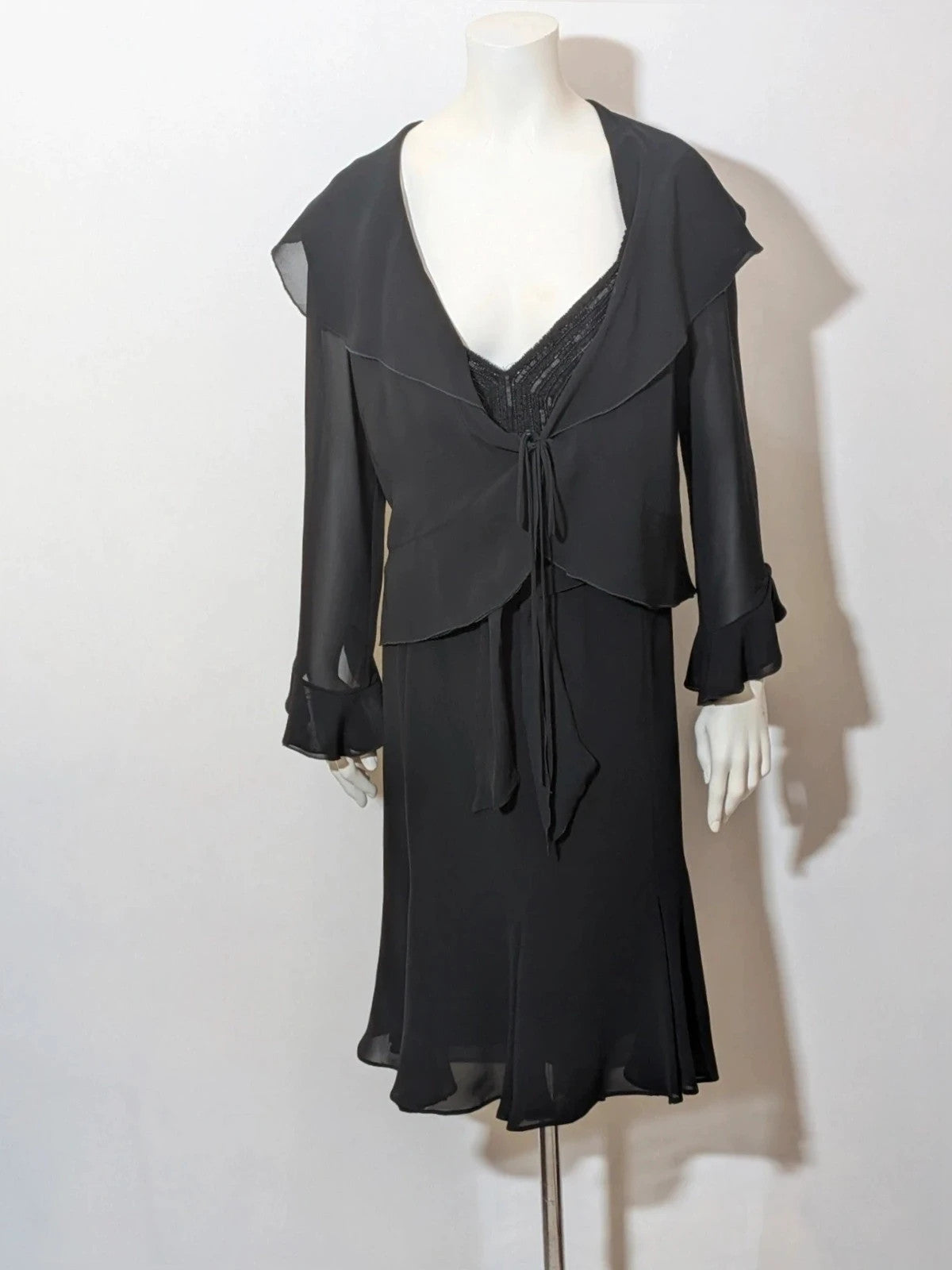 Modyva black casual ruffle maxi dress with sequined top and elegant belt detail.
