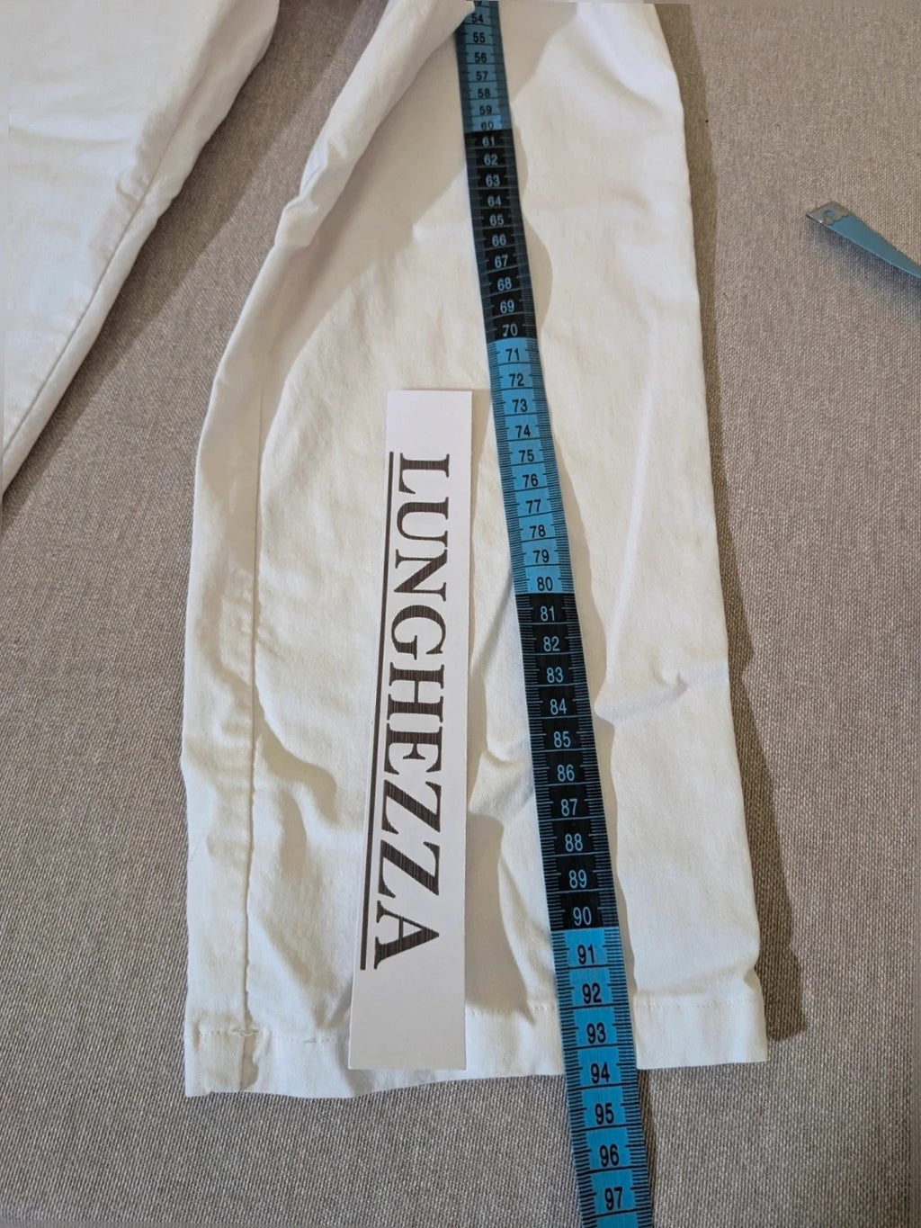 M-Made in Italy turquoise blazer suit with elegant lapel and white trousers, cotton blend.