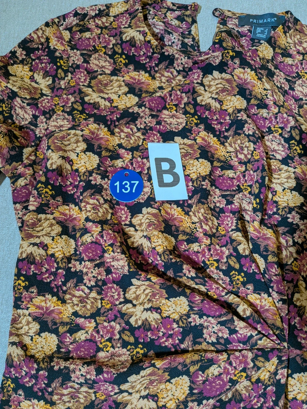 Gerry Weber multi suit with floral Primark top, draped design, and camel trousers.
