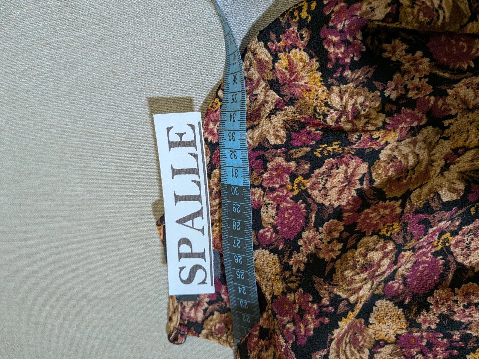 Gerry Weber multi suit with floral Primark top, draped design, and camel trousers.