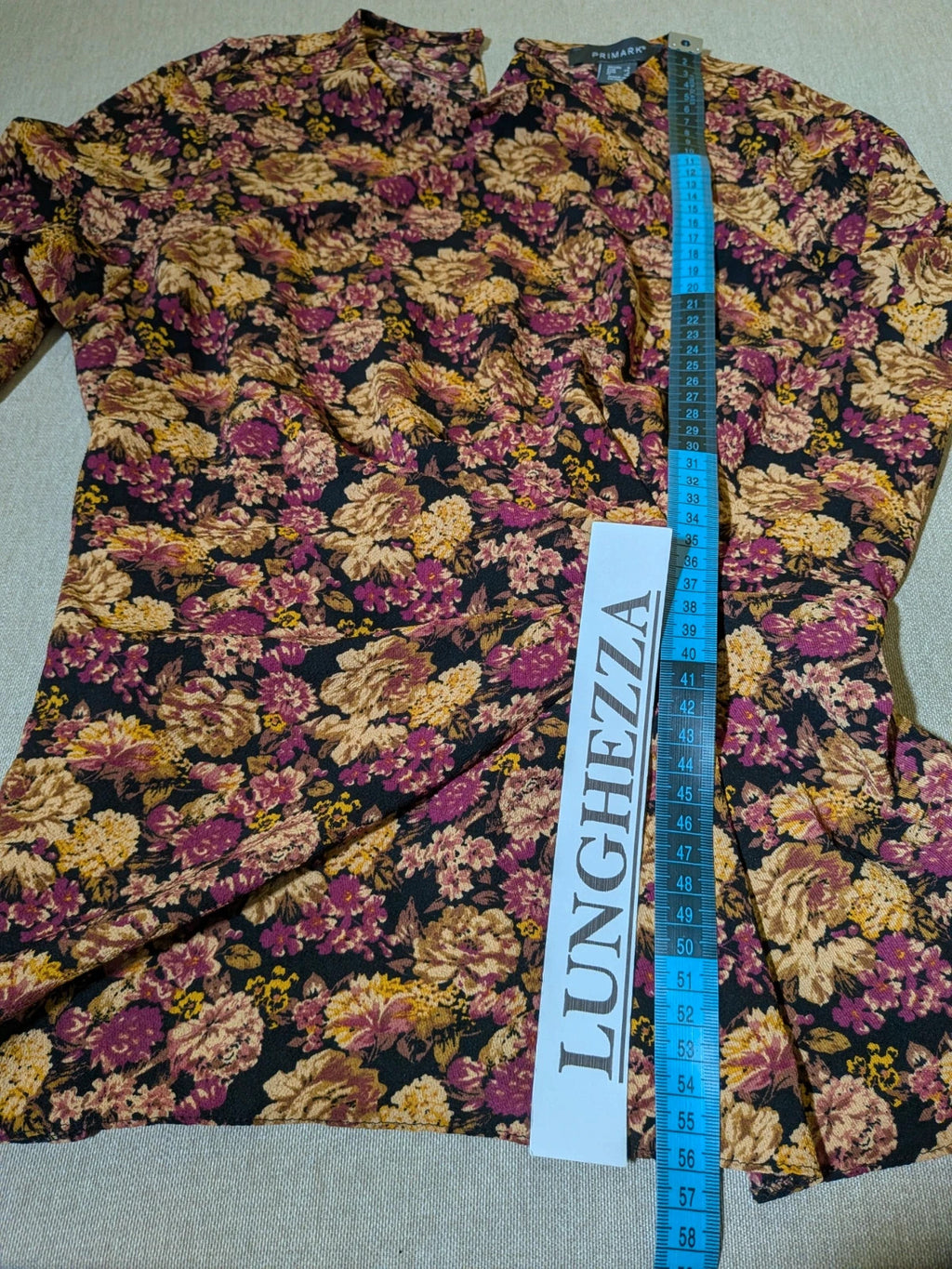 Gerry Weber multi suit with floral Primark top, draped design, and camel trousers.