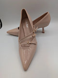 Mix Feel beige heels with pointed toe, glossy patent finish, and decorative gold buckles.