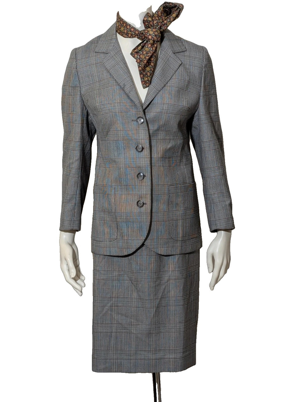 Retro grey multi skirt suit with Prince of Wales check pattern, structured jacket and fully lined skirt.