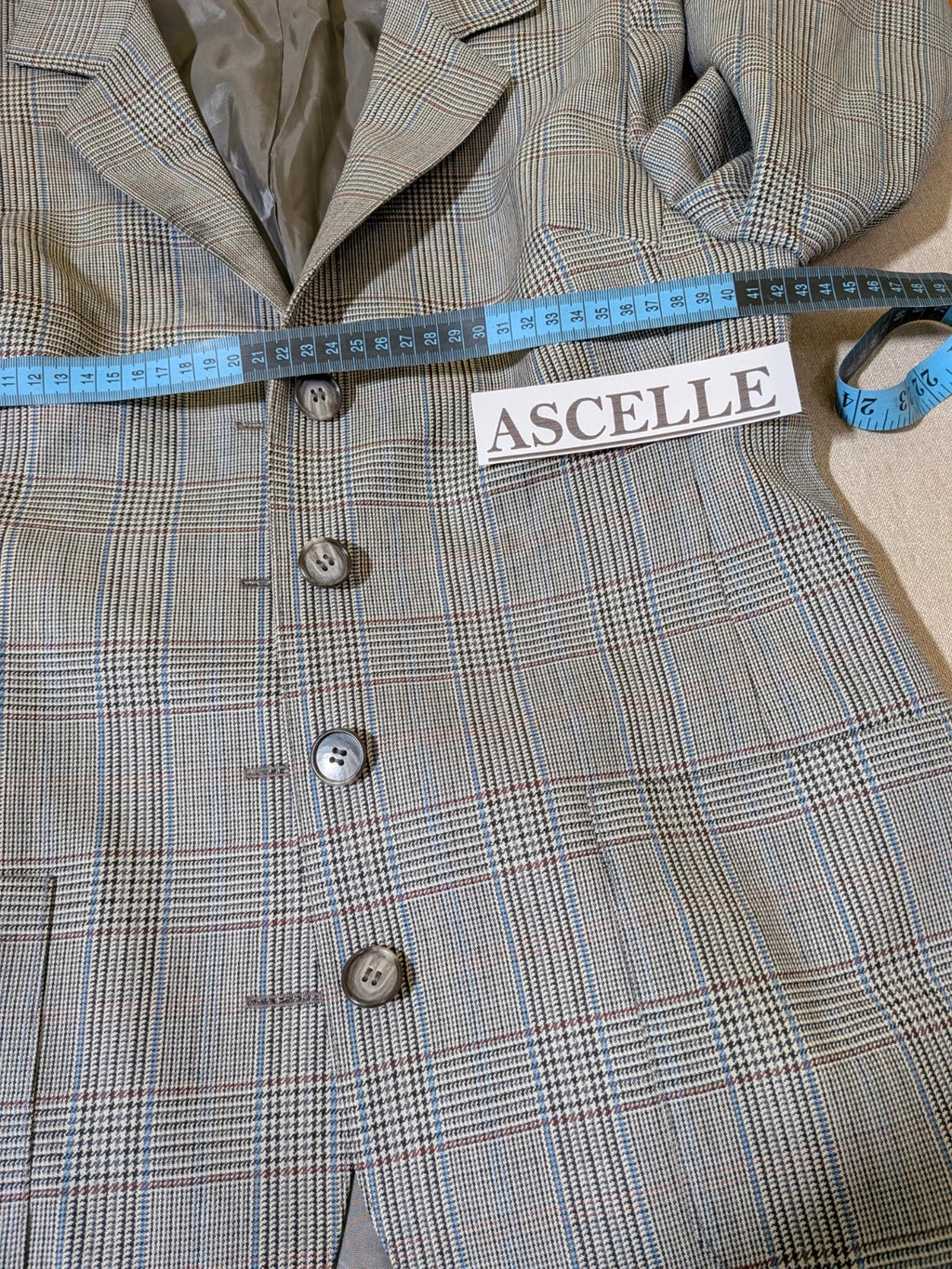 Retro grey multi skirt suit with Prince of Wales check pattern, structured jacket and fully lined skirt.