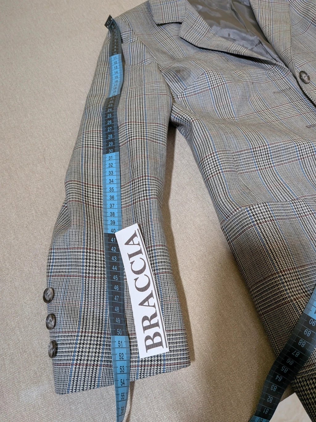 Retro grey multi skirt suit with Prince of Wales check pattern, structured jacket and fully lined skirt.