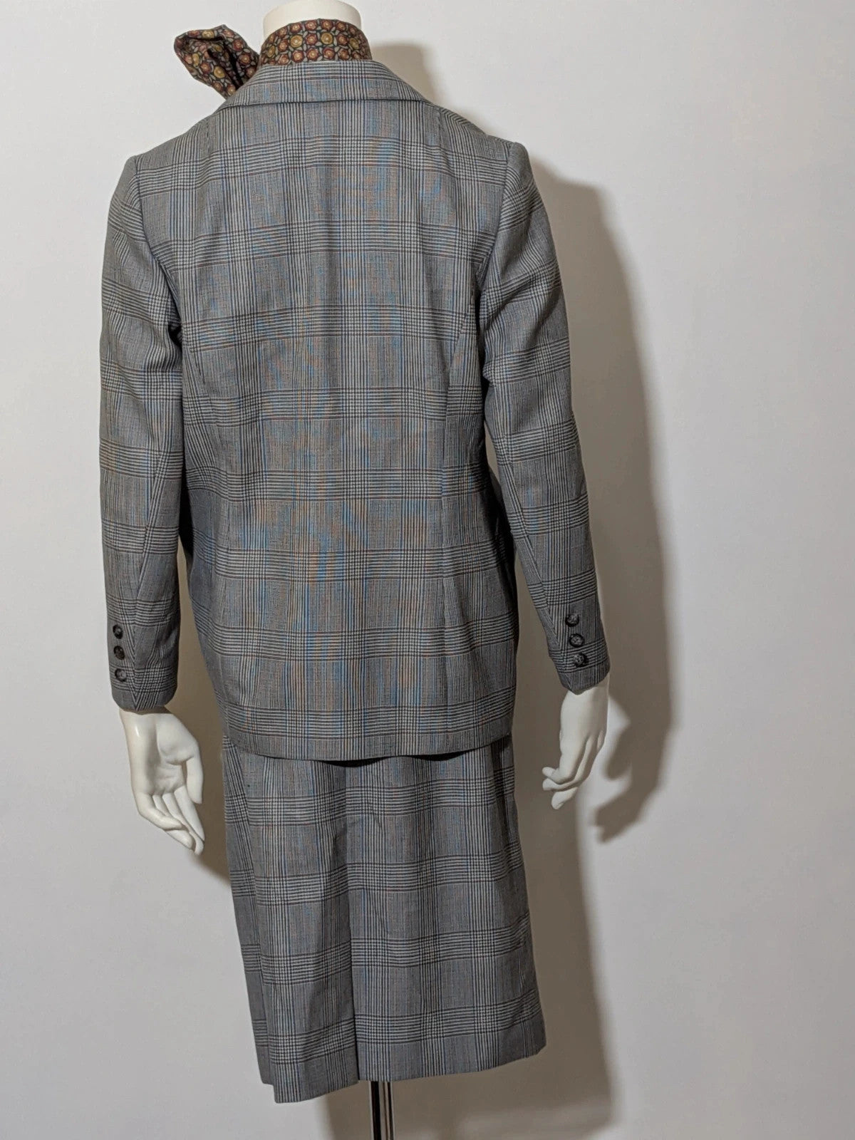 Retro grey multi skirt suit with Prince of Wales check pattern, structured jacket and fully lined skirt.