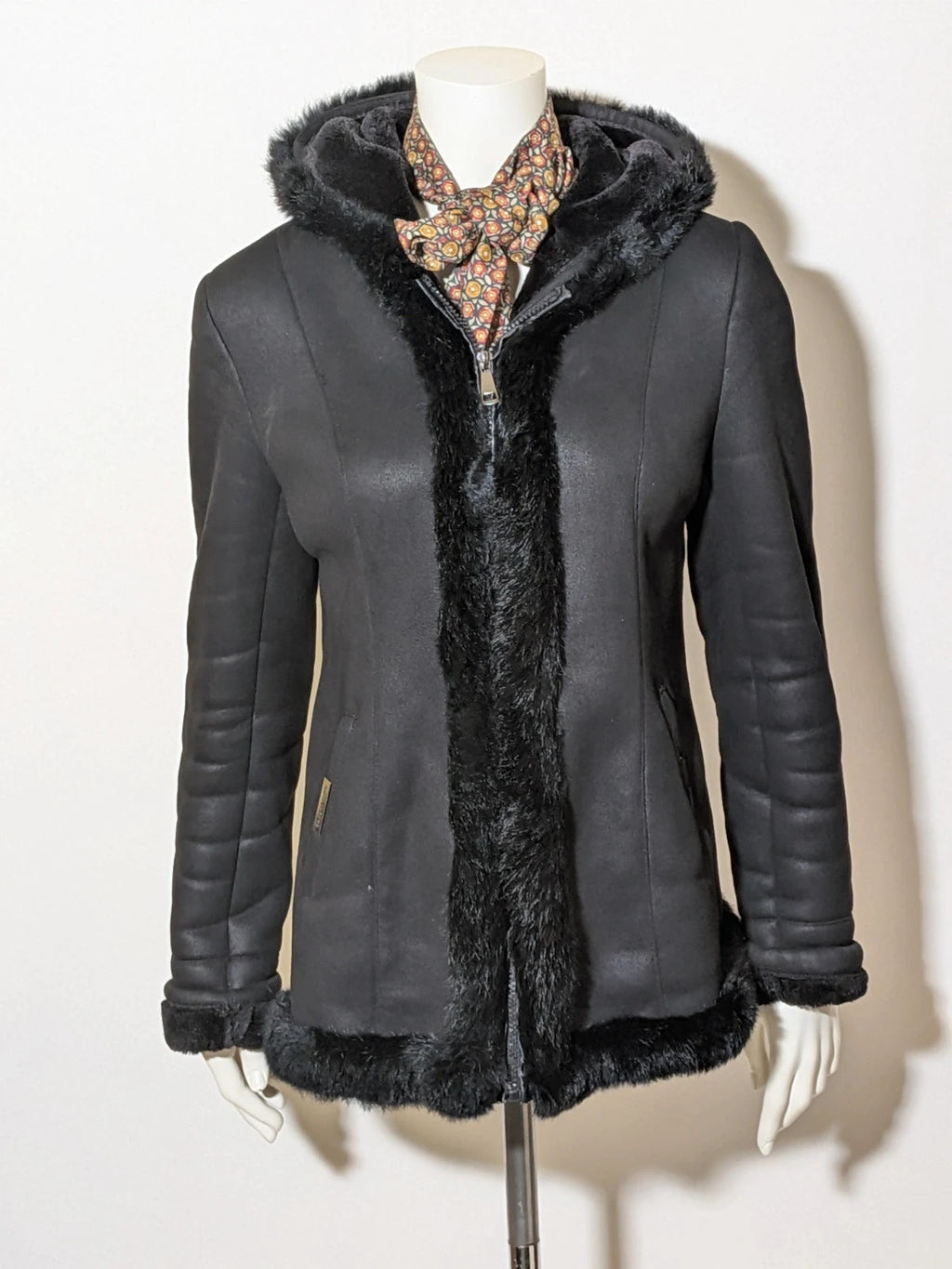 Bright Girl black jacket eco-leather with integrated hood and faux fur details.