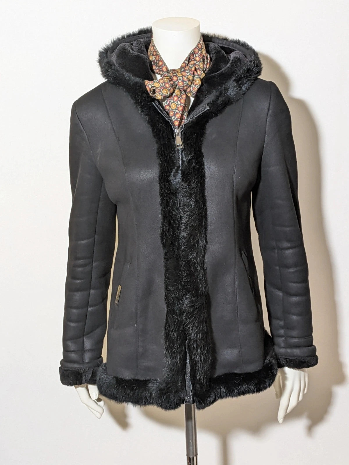 Bright Girl black jacket eco-leather with integrated hood and faux fur details.