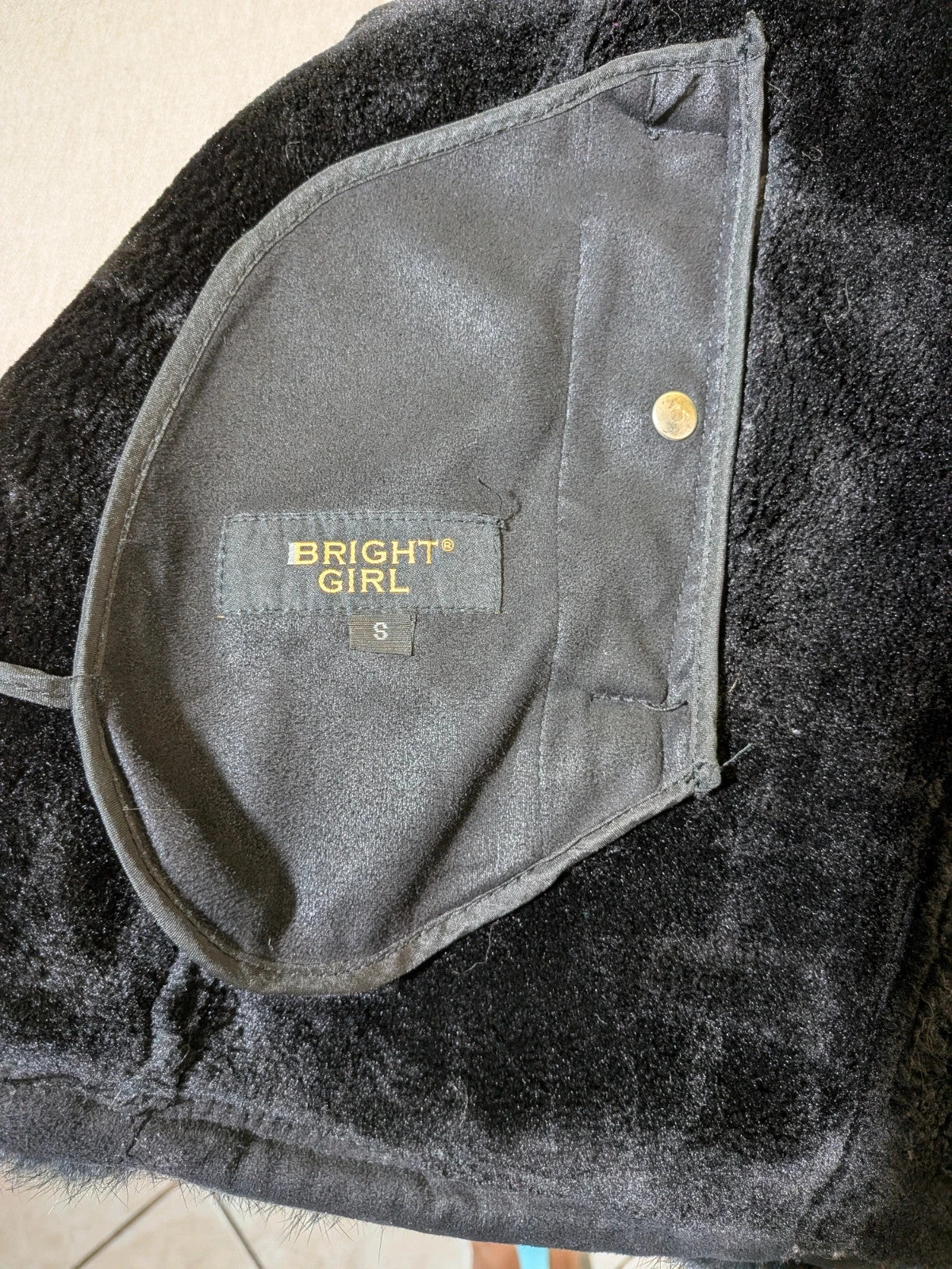 Bright Girl black jacket eco-leather with integrated hood and faux fur details.