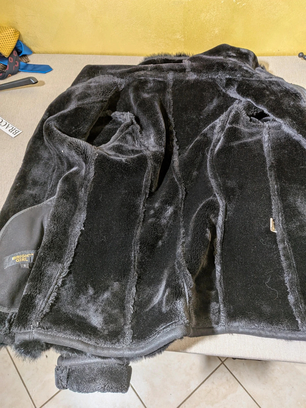 Bright Girl black jacket eco-leather with integrated hood and faux fur details.