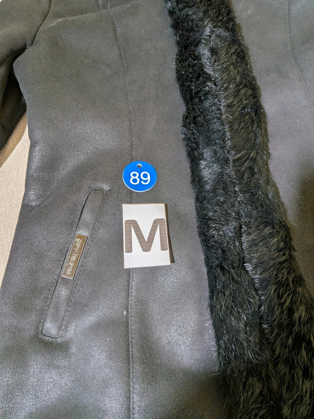 Bright Girl black jacket eco-leather with integrated hood and faux fur details.