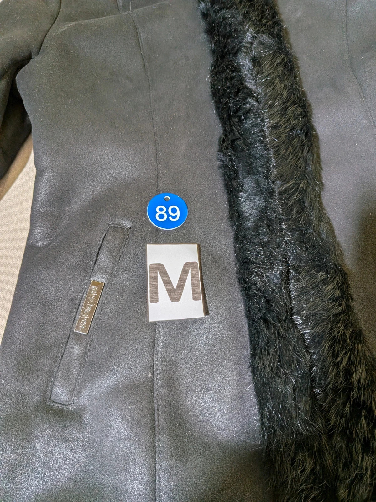 Bright Girl black jacket eco-leather with integrated hood and faux fur details.