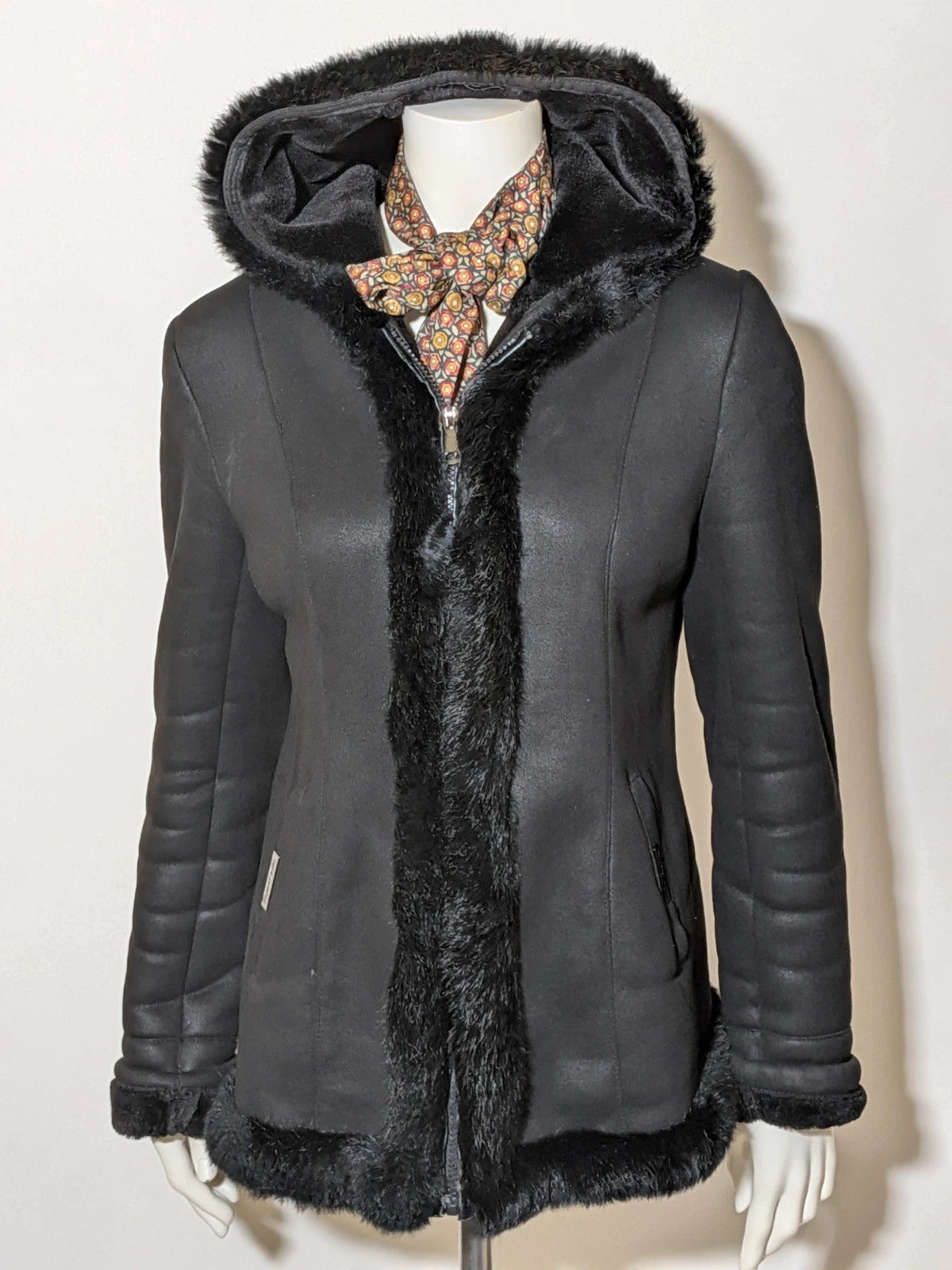 Bright Girl black jacket eco-leather with integrated hood and faux fur details.