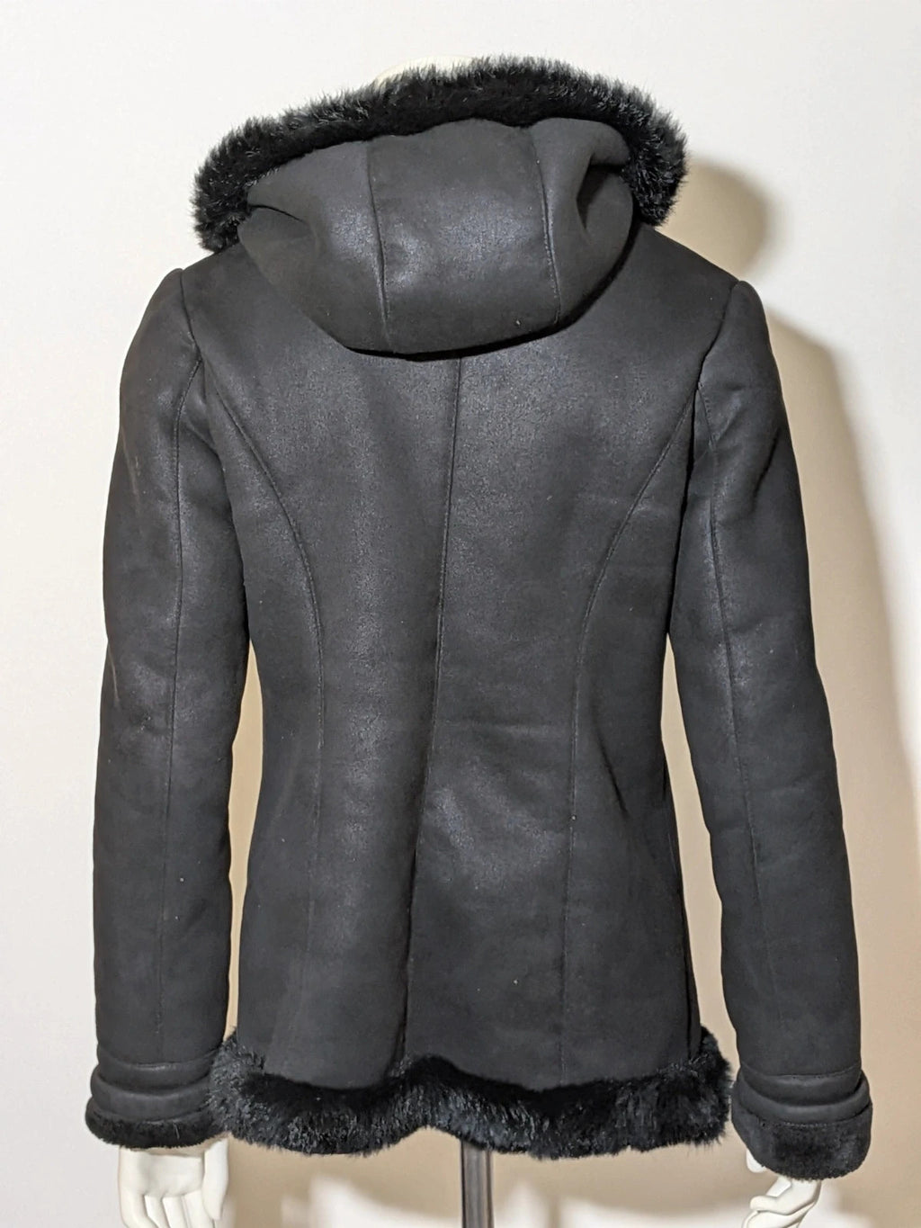 Bright Girl black jacket eco-leather with integrated hood and faux fur details.
