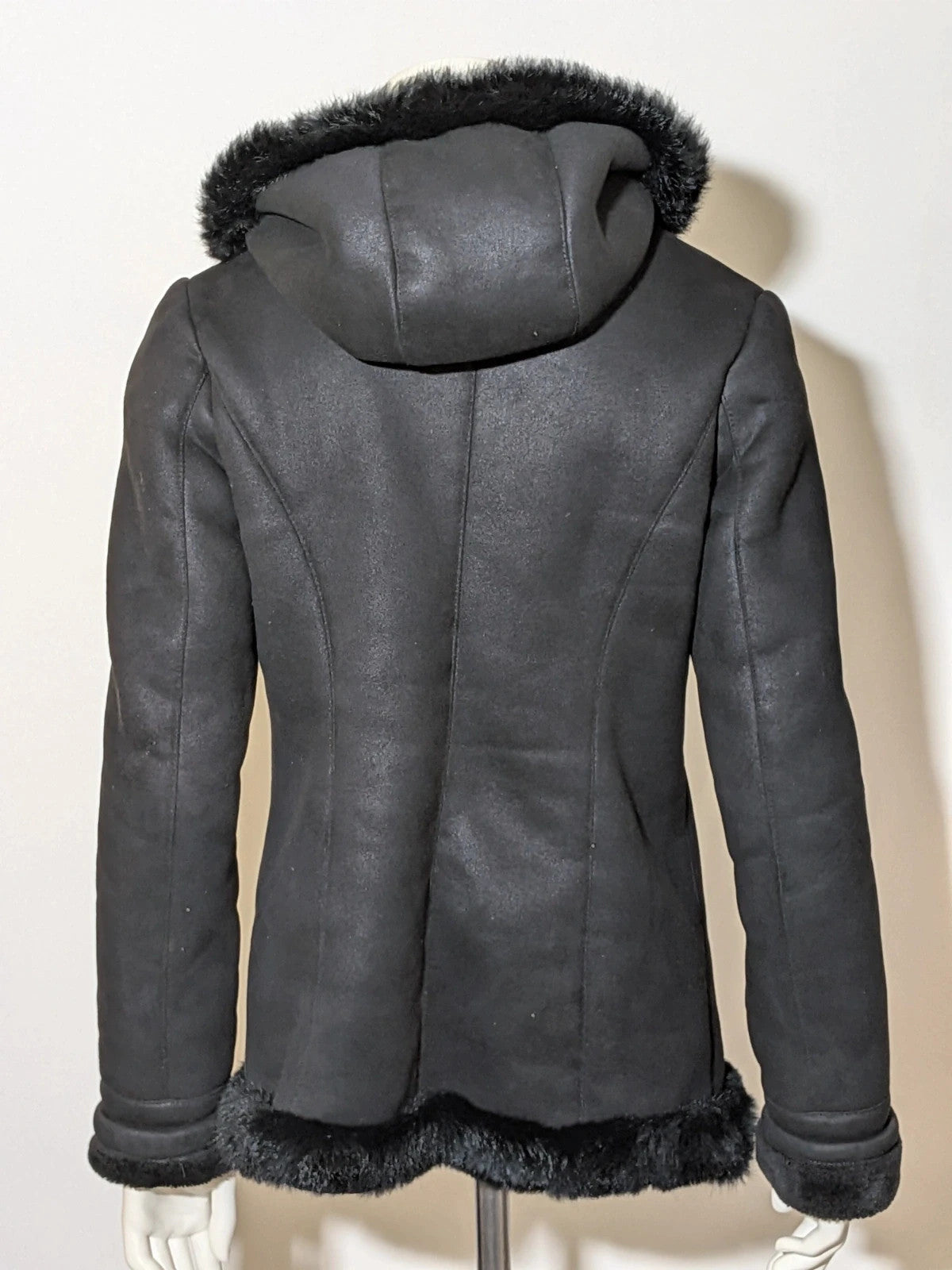 Bright Girl black jacket eco-leather with integrated hood and faux fur details.