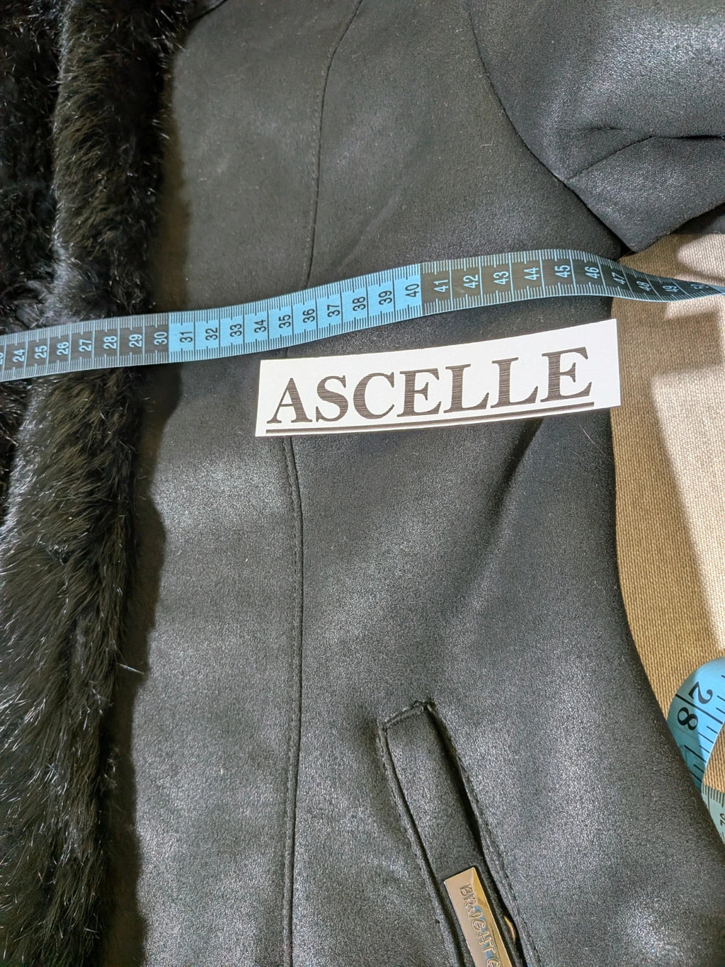 Bright Girl black jacket eco-leather with integrated hood and faux fur details.
