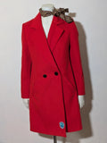 Studio F red coat with black button closure and gold logo tag on collar.