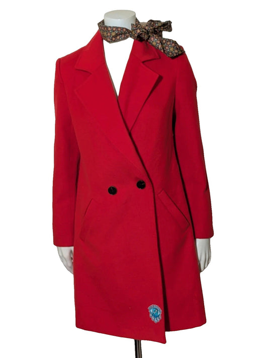 Studio F red coat with black button closure and gold logo tag on collar.